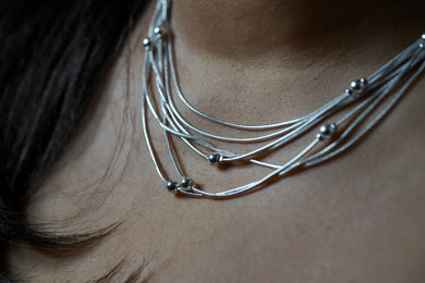 Silver Fashion Necklace, seven silver strands with silver beads throughout, adjustable in length